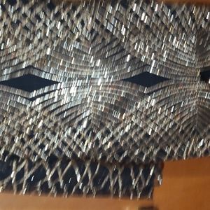 Gold and black sequins dress.